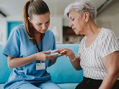 nurse with patient checking oxygen